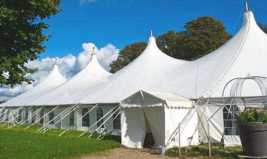 a line of sleek and modern portable toilets ready for use at an upscale corporate event in Cambridge